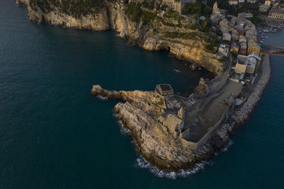 High angle view of rock by sea