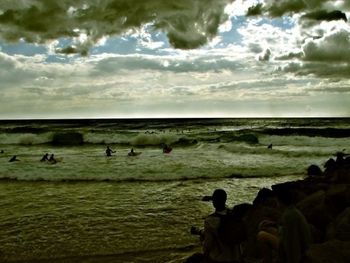 Scenic view of sea against cloudy sky