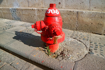 High angle view of fire hydrant on footpath