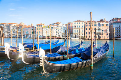 Boats moored at harbor