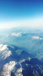 Aerial view of mountain range against sky