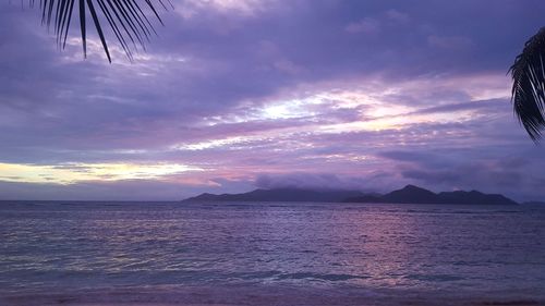 View of seascape against cloudy sky