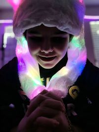 Portrait of a boy holding purple