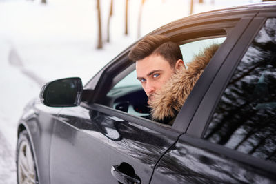 Portrait of man in car