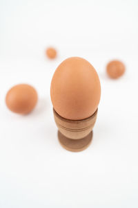 Close-up of egg against white background