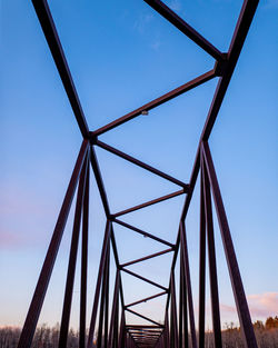 Low angle view of bridge against clear blue sky