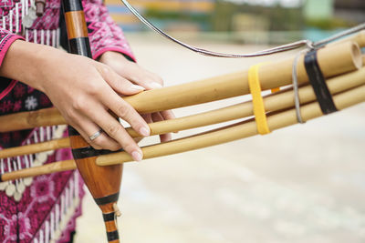 Close-up of hands playing guitar