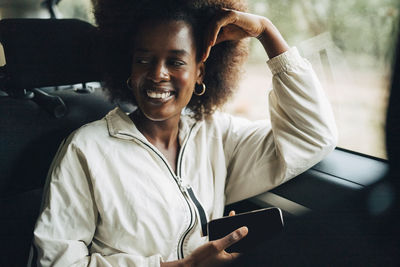 Young woman using mobile phone