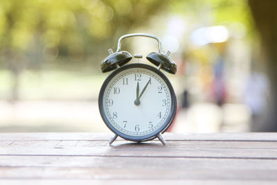 Close-up of alarm clock on table