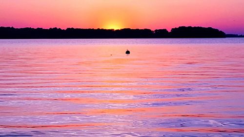 Scenic view of sea at sunset