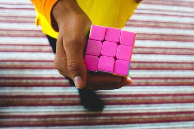 Woman holding cube