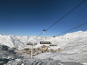 Low angle view of snow covered mountain against sky