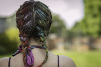 Rear view of woman against sky