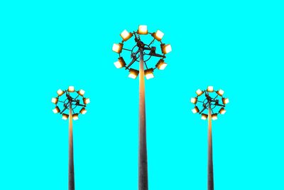 Street light against blue sky