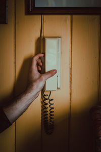 Close-up of hand on window