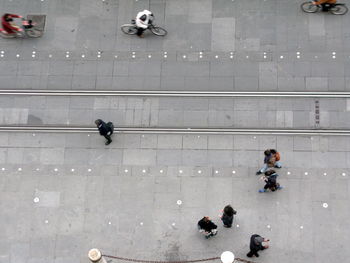 Directly above shot of people by tramway on street