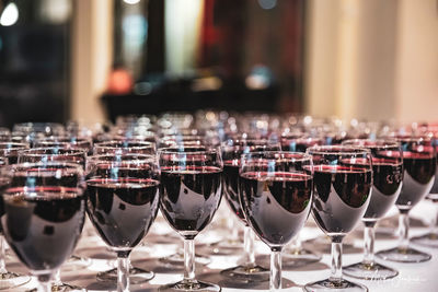 Close-up of wine glasses on table