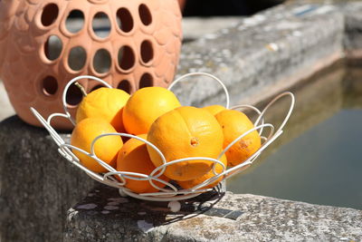 High angle view of orange in basket on table