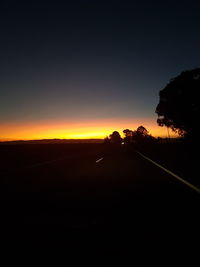 Scenic view of silhouette landscape against clear sky during sunset