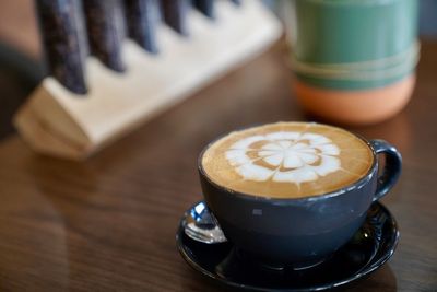 Close-up of coffee cup on table