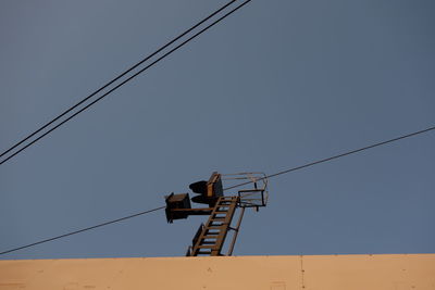 Low angle view of electricity pylon