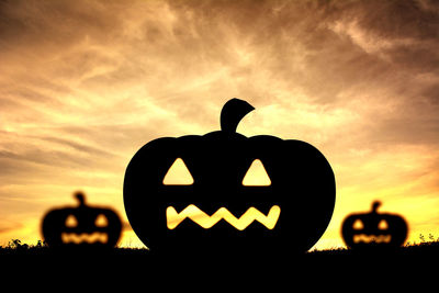 Silhouette of pumpkin during sunset