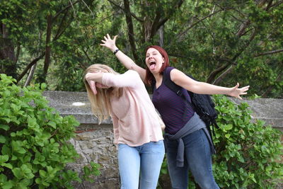 Playful female friends enjoying outdoors