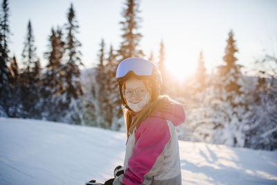 View of girl on ski slope