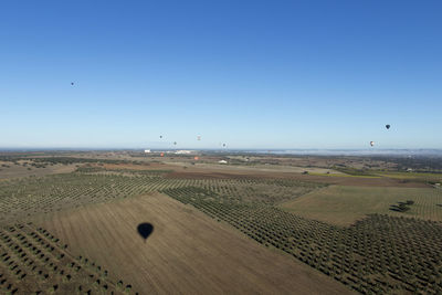 Scenic view of landscape against clear blue sky