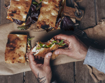 High angle view of man preparing food on table