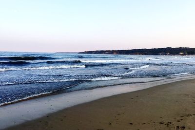 Scenic view of beach against clear sky