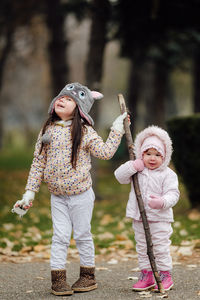 Full length of cute girl standing outdoors