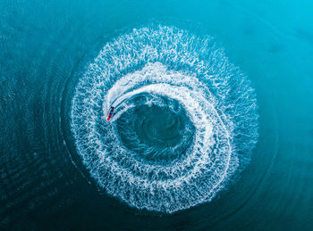 Circle of water motion drone wallpaper and a jetski from puerto rico luquillo la monseratte beach.