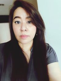 Close-up portrait of smiling young woman