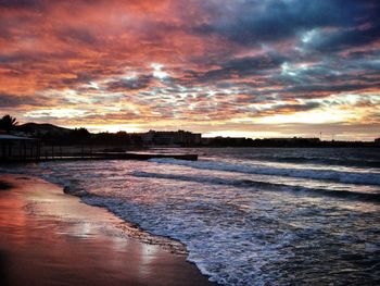 Scenic view of sea against cloudy sky