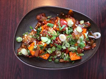 High angle view of chopped vegetables in bowl on table