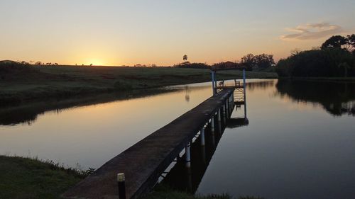 Scenic view of lake at sunset