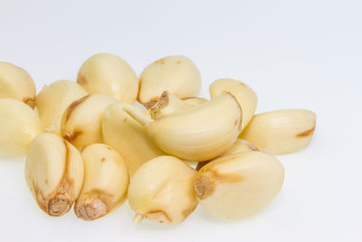 Close-up of eggs against white background