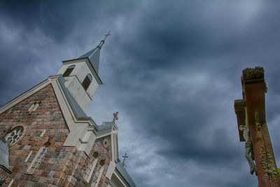 Low angle view of bell tower against sky