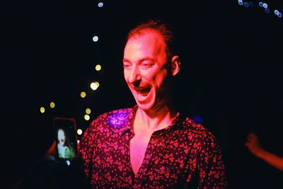 Portrait of handsome man at night