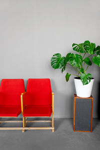 Empty chairs and table against wall at home