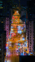 Illuminated city street and buildings at night