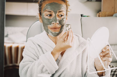 Portrait of young woman wearing mask