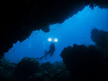 People scuba diving in sea