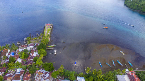 High angle view of buildings by sea