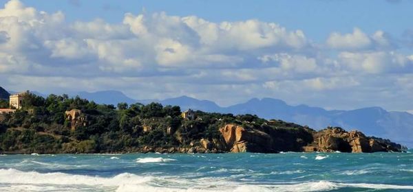 Scenic view of sea against cloudy sky