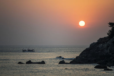 Scenic view of sea against sky during sunset