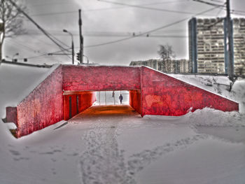 Snow covered road against sky during rainy season
