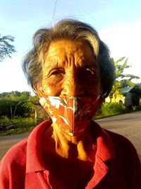 Portrait of mature man against sky