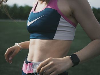 Midsection of woman holding hands